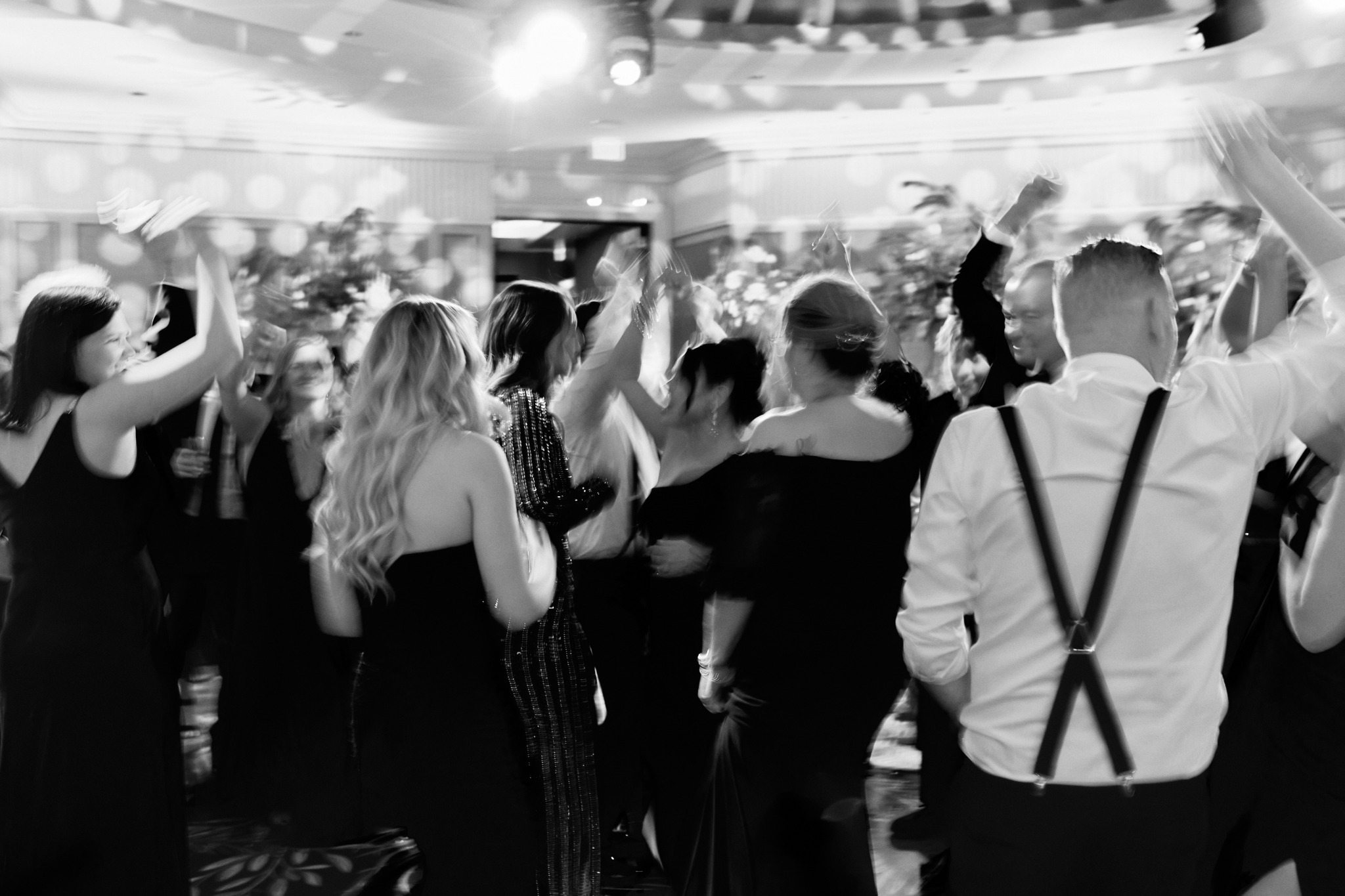 Wedding guests celebrating together on the dance floor