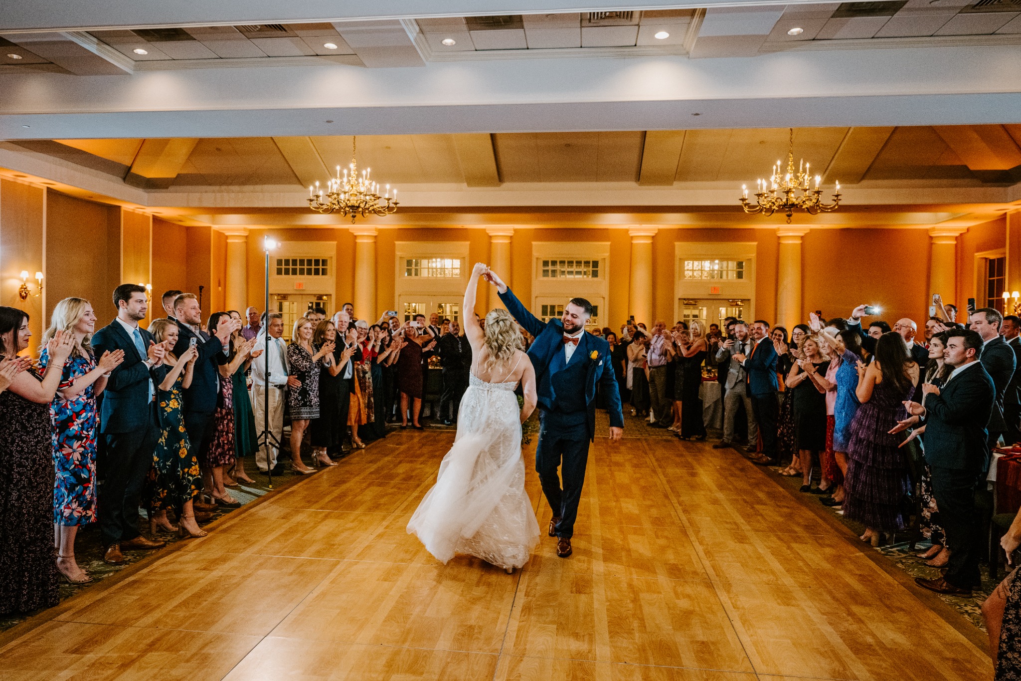 A wedding reception room prepared with professional lighting and DJ entertainment