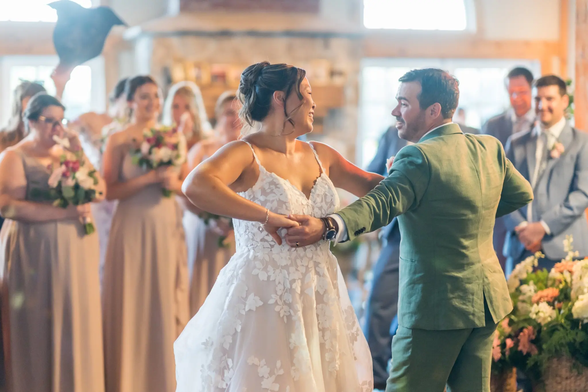 Newlyweds dancing together during their wedding reception